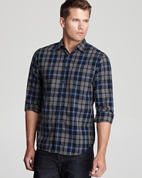 Clean up your look with a quick change into this plaid button-down, tailored for a slim fit to match your modern attire. Clean up your look with a quick change into this plaid button-down, tailored for a slim fit to match your modern attire.