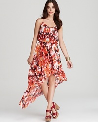 From the vibrant floral print to the dramatic high/low hem, this GUESS dress is sure to delight the season. From the vibrant floral print to the dramatic high/low hem, this GUESS dress is sure to delight the season.