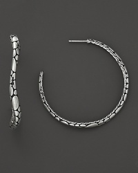 Undulating hoops resemble a handful of gleaming pebbles, sculpted in sterling silver. From the Kali collection. Undulating hoops resemble a handful of gleaming pebbles, sculpted in sterling silver. From the Kali collection.