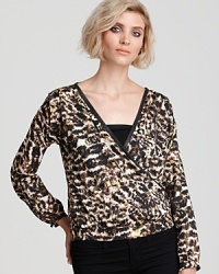 Reveal your animal instincts and trendsetting flair in this silky PJK Patterson J. Kincaid blouse, enriched with a bold cheetah print and leather-trimmed accents. Reveal your animal instincts and trendsetting flair in this silky PJK Patterson J. Kincaid blouse, enriched with a bold cheetah print and leather-trimmed accents.