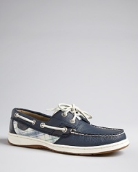 In tanned leather and classic plaid, a rustic look shines on a classic pair of boat shoes from Sperry Top-Sider. Clear sequins give the pattern extra pop. In tanned leather and classic plaid, a rustic look shines on a classic pair of boat shoes from Sperry Top-Sider. Clear sequins give the pattern extra pop.