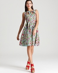Opt for ladylike sophistication with a lighthearted edge in this Nanette Lepore dress, flaunting a poppy floral print and charming bows. Opt for ladylike sophistication with a lighthearted edge in this Nanette Lepore dress, flaunting a poppy floral print and charming bows.