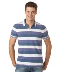 With a crisp, nautical-inspired stripe, this Calvin Klein polo shirt is a warm-weather must-have. With a crisp, nautical-inspired stripe, this Calvin Klein polo shirt is a warm-weather must-have.