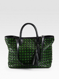 Lined in cotton with a charming polka-dot print, a woven-leather bag with a detachable shoulder strap.Double top handles, 5 dropDetachable shoulder strap, 13½ dropSnap closureProtective metal feetOne inside zip pocketTwo inside open pocketsCotton lining13½W X 10½H X 6DImported Lined in cotton with a charming polka-dot print, a woven-leather bag with a detachable shoulder strap.Double top handles, 5 dropDetachable shoulder strap, 13½ dropSnap closureProtective metal feetOne inside zip pocketTwo inside open pocketsCotton lining13½W X 10½H X 6DImported