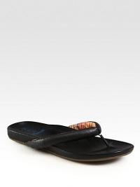 Embossed leather thongs, lined in signature stripes, take designer style to the beach and beyond.Leather liningPadded insoleRubber soleImported Embossed leather thongs, lined in signature stripes, take designer style to the beach and beyond.Leather liningPadded insoleRubber soleImported