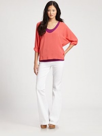 Relaxed dolman top features a contrasting tank for a bold colorblock effect. U-neckThree-quarter dolman sleevesTop: RayonTank: 90% supima cotton/10% spandexDry cleanMade in USAModel shown is 5'10 (177cm) wearing US size Small. Relaxed dolman top features a contrasting tank for a bold colorblock effect. U-neckThree-quarter dolman sleevesTop: RayonTank: 90% supima cotton/10% spandexDry cleanMade in USAModel shown is 5'10 (177cm) wearing US size Small.