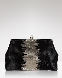 A smattering of iridescent beads lend a textured appeal to the slim and structured silhouette of this Badgley Mischka clutch, which is secured by a top snap closure.