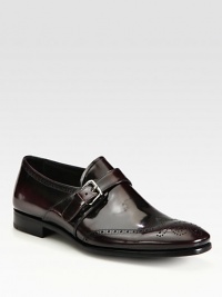 Impeccable craftsmanship in fine Italian leather with monk strap and perforated detail.Leather upperLeather liningRubber soleMade in Italy Impeccable craftsmanship in fine Italian leather with monk strap and perforated detail.Leather upperLeather liningRubber soleMade in Italy