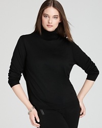 Cozy meets chic as sumptuous wool outfits a sleek Lafayette 148 New York turtleneck. Cozy meets chic as sumptuous wool outfits a sleek Lafayette 148 New York turtleneck.