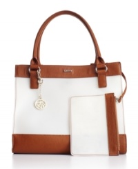 A chic take on the so-now jelly trend, this DKNY bag features a smooth rubber exterior with contrast trim. This eye-catching bag moves to the top of the style class with polished signature hardware and a matching wristlet. A chic take on the so-now jelly trend, this DKNY bag features a smooth rubber exterior with contrast trim. This eye-catching bag moves to the top of the style class with polished signature hardware and a matching wristlet.
