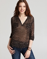 Lend a hint of the exotic to your trans-seasonal wardrobe with this Joie top, emboldened by a wildly chic animal print. Lend a hint of the exotic to your trans-seasonal wardrobe with this Joie top, emboldened by a wildly chic animal print.