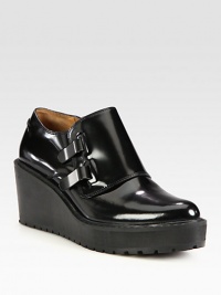 Dual metal tab closures contrast against this leather silhouette on an elevated wedge. Rubber heel, 2¾ (70mm)Rubber platform, 1 (25mm)Compares to a 1¾ heel (45mm)Leather upperLeather liningRubber trek solePadded insoleImportedOUR FIT MODEL RECOMMENDS ordering one half size up as this style runs small. Dual metal tab closures contrast against this leather silhouette on an elevated wedge. Rubber heel, 2¾ (70mm)Rubber platform, 1 (25mm)Compares to a 1¾ heel (45mm)Leather upperLeather liningRubber trek solePadded insoleImportedOUR FIT MODEL RECOMMENDS ordering one half size up as this style runs small.