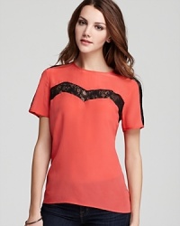 Strategically placed lace sets an enticing mood on this French Connection top, constructed in sumptuous silk. Strategically placed lace sets an enticing mood on this French Connection top, constructed in sumptuous silk.