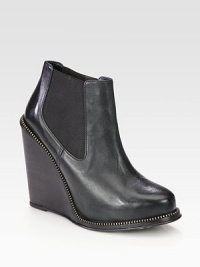 Street-cool leather design on a powerful stacked wedge with edgy zipper trim. Stacked wedge, 4½ (115mm)Leather upper with zipper trim and side elastic goresPull-on styleLeather lining and solePadded insoleImported Street-cool leather design on a powerful stacked wedge with edgy zipper trim. Stacked wedge, 4½ (115mm)Leather upper with zipper trim and side elastic goresPull-on styleLeather lining and solePadded insoleImported