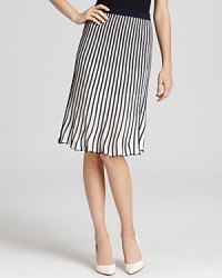 Pleats made the runway a sensation and this BCBGMAXAZRIA skirt explores the trend with a two-tone rendering and easy pull-on style. Add a simple black sweater and pointy pumps to punctuate the look perfectly. Pleats made the runway a sensation and this BCBGMAXAZRIA skirt explores the trend with a two-tone rendering and easy pull-on style. Add a simple black sweater and pointy pumps to punctuate the look perfectly.