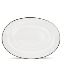 For nearly 150 years, Lenox has been renowned throughout the world as a premier designer and manufacturer of fine china. The simple and classic Hannah Platinum pattern brings a timeless refinement to your formal entertaining table, in pure white bone china embossed with a subtle palmetto-leaf design, and banded in platinum. Gravy stand shown back right.