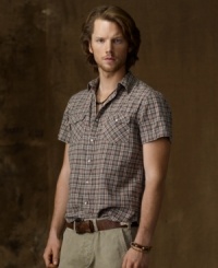 Channeling homespun style in softly textured woven cotton, a short-sleeved Western shirt in rugged plaid gives off an effortless, laid-back vibe. Channeling homespun style in softly textured woven cotton, a short-sleeved Western shirt in rugged plaid gives off an effortless, laid-back vibe.