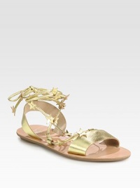 Glimmering metallic leather flat anchored by a unique, star-bedecked tie that makes its way up the ankle. Metallic leather upperLeather liningRubber soleImportedOUR FIT MODEL RECOMMENDS ordering true size. Glimmering metallic leather flat anchored by a unique, star-bedecked tie that makes its way up the ankle. Metallic leather upperLeather liningRubber soleImportedOUR FIT MODEL RECOMMENDS ordering true size.