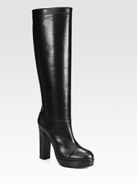 Make an entrance with this sky-high silhouette of ultra-luxe leather, supported by a block heel and elevated platform. Stacked heel, 4¾ (120mm)Covered platform, 1 (25mm)Compares to a 3¾ heel (95mm)Shaft, 16Leg circumference, 15Leather upperPull-on styleLeather liningRubber trek solePadded insoleMade in ItalyOUR FIT MODEL RECOMMENDS ordering one half size up as this style runs small. Make an entrance with this sky-high silhouette of ultra-luxe leather, supported by a block heel and elevated platform. Stacked heel, 4¾ (120mm)Covered platform, 1 (25mm)Compares to a 3¾ heel (95mm)Shaft, 16Leg circumference, 15Leather upperPull-on styleLeather liningRubber trek solePadded insoleMade in ItalyOUR FIT MODEL RECOMMENDS ordering one half size up as this style runs small.