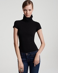 The stretch fit of this turtleneck top from Theory makes for an easy, flattering option you can wear alone or under your coziest cardigan. The stretch fit of this turtleneck top from Theory makes for an easy, flattering option you can wear alone or under your coziest cardigan.