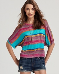Top off your weekend wardrobe with this vividly striped Michael Stars tee, complete with wide dolman sleeves for a billowy silhouette. Top off your weekend wardrobe with this vividly striped Michael Stars tee, complete with wide dolman sleeves for a billowy silhouette.