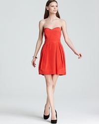 Cut a short and sweet silhouette in this Shoshanna strapless dress, splashed in an eye-catching hue. Cut a short and sweet silhouette in this Shoshanna strapless dress, splashed in an eye-catching hue.