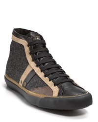 Skater style from Paul Smith, this leather hi-top adds textured wool side panels and stripe details. Skater style from Paul Smith, this leather hi-top adds textured wool side panels and stripe details.