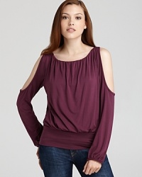 Cut from supple jersey, this Akiko top flaunts cutout shoulders for a sultry finish. Cut from supple jersey, this Akiko top flaunts cutout shoulders for a sultry finish.