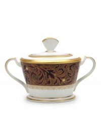 Add drama to your tabletop with this bold pattern from Noritake! Strikingly elegant, this bone china features a rich gold and red brocade border adorned with soft ivory dots and a gold band. Add drama to your tabletop with this bold pattern from Noritake! Strikingly elegant, this bone china features a rich gold and red brocade border adorned with soft ivory dots and a gold band.