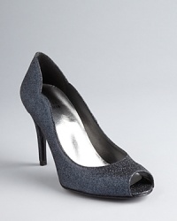 Slip into these sparkling Stuart Weitzman peep toe pumps; just the right amount of shine and an intriguing scalloped edge add up to one sophisticated evening style. Slip into these sparkling Stuart Weitzman peep toe pumps; just the right amount of shine and an intriguing scalloped edge add up to one sophisticated evening style.