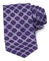 An optic floral print conforms into a grid-like pattern on a silk tie from Ike Behar. An optic floral print conforms into a grid-like pattern on a silk tie from Ike Behar.