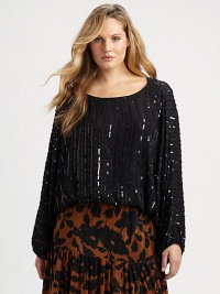 Made from fine Indian silk, a shimmering top with a relaxed-yet-feminine fit you will adore.Round neckLong sleevesPull-on styleAbout 22 from shoulder to hemSilkDry cleanImported Made from fine Indian silk, a shimmering top with a relaxed-yet-feminine fit you will adore.Round neckLong sleevesPull-on styleAbout 22 from shoulder to hemSilkDry cleanImported