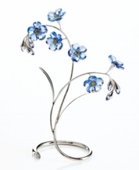 Faceted crystal forget-me-nots bloom indefinitely in cool sapphire on silvertone stems. With lime crystal and tanzanite details, these delicate Swarovski flowers make a ravishing home accent. Faceted crystal forget-me-nots bloom indefinitely in cool sapphire on silvertone stems. With lime crystal and tanzanite details, these delicate Swarovski flowers make a ravishing home accent.