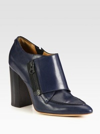 Sleek Italian leather is paired with contrasting exposed zipper in this point toe design, resting on a tall block heel. Stacked heel, 4 (100mm)Leather upperSide zipLeather lining and solePadded insoleMade in ItalyOUR FIT MODEL RECOMMENDS ordering one half size up as this style runs small. Sleek Italian leather is paired with contrasting exposed zipper in this point toe design, resting on a tall block heel. Stacked heel, 4 (100mm)Leather upperSide zipLeather lining and solePadded insoleMade in ItalyOUR FIT MODEL RECOMMENDS ordering one half size up as this style runs small.
