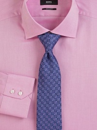 A clean, gently textured dress shirt is cut with a classic fit. ButtonfrontRegular fitSpread collarCottonDry cleanImported