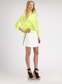 Topped with oversized patch pockets, this semi-sheer silk style has roll-tab sleeves and a hidden button front. Point collarHidden button frontFront patch pocketsThree-quarter roll-tab sleevesLonger length hits below the hipsSilkDry cleanImportedModel shown is 5'10 (177cm) wearing US size 4. Topped with oversized patch pockets, this semi-sheer silk style has roll-tab sleeves and a hidden button front. Point collarHidden button frontFront patch pocketsThree-quarter roll-tab sleevesLonger length hits below the hipsSilkDry cleanImportedModel shown is 5'10 (177cm) wearing US size 4.