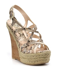 Mixed materials get together for a statement-making look from Boutique 9, finished off with a raffia platform and cork heel. Mixed materials get together for a statement-making look from Boutique 9, finished off with a raffia platform and cork heel.