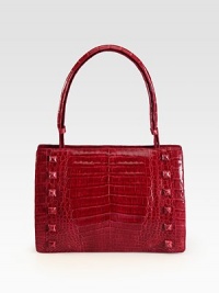 A glossy crocodile design with self covered stud accents.Adjustable top handle, 7½-8 dropHinged magnetic closureProtective crocodile covered feetOne inside zip pocketTwo inside open pocketsSuede lining11W X 7½H X 3DImported A glossy crocodile design with self covered stud accents.Adjustable top handle, 7½-8 dropHinged magnetic closureProtective crocodile covered feetOne inside zip pocketTwo inside open pocketsSuede lining11W X 7½H X 3DImported
