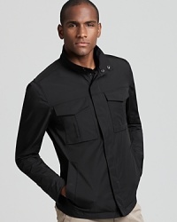 Streamlined and modern, a black waist-length zip up jacket from Theory adds instant style to transitional weather attire. Streamlined and modern, a black waist-length zip up jacket from Theory adds instant style to transitional weather attire.