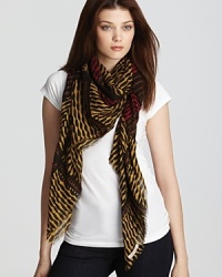 Go on an expedition in Burberry's exotic scarf, in bold shades of black and turmeric. Go on an expedition in Burberry's exotic scarf, in bold shades of black and turmeric.