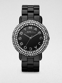 A sleek timepiece with a dazzling crystal encrusted bezel. Quartz movementWater resistant to 5 ATMRound blackened stainless steel case, 36mm (1.4)Crystal encrusted bezelBlack dialLogo hour markersSecond hand Blackened stainless steel link braceletImported A sleek timepiece with a dazzling crystal encrusted bezel. Quartz movementWater resistant to 5 ATMRound blackened stainless steel case, 36mm (1.4)Crystal encrusted bezelBlack dialLogo hour markersSecond hand Blackened stainless steel link braceletImported