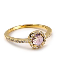 A checkerboard, dome cut center stone with talon prongs is surrounded in sparkling CZ stones on this small-but-statement-making Crislu ring. A checkerboard, dome cut center stone with talon prongs is surrounded in sparkling CZ stones on this small-but-statement-making Crislu ring.