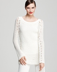 An easy tunic silhouette in an airy open knit ensures you can wear this versatile Donna Karan New York sweater over both casual and dressy looks throughout the year. An easy tunic silhouette in an airy open knit ensures you can wear this versatile Donna Karan New York sweater over both casual and dressy looks throughout the year.