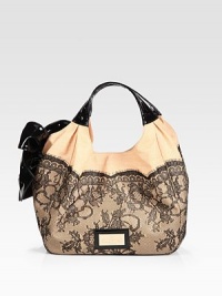 Ultra-feminine in woven straw trimmed with sheer lace and a lustrous patent leather bow.Patent leather double top handles, 5¼ dropTop snap closureProtective metal feetCenter zip compartmentOne inside zip pocketTwo inside open pocketsLeather/canvas lining13½W X 9¼H X 4½DMade in Italy Ultra-feminine in woven straw trimmed with sheer lace and a lustrous patent leather bow.Patent leather double top handles, 5¼ dropTop snap closureProtective metal feetCenter zip compartmentOne inside zip pocketTwo inside open pocketsLeather/canvas lining13½W X 9¼H X 4½DMade in Italy