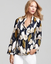 Subtle sequins shimmer on this cotton voile Tory Burch floral-printed tunic, lending a touch of glamour to a whimsical look. Subtle sequins shimmer on this cotton voile Tory Burch floral-printed tunic, lending a touch of glamour to a whimsical look.