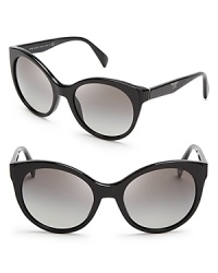 Prada brings its elegant aesthetic and mastery of '50s style to the ultra-fashionable cat eye in these appealing sunglasses. Prada brings its elegant aesthetic and mastery of '50s style to the ultra-fashionable cat eye in these appealing sunglasses.
