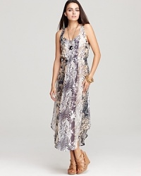 A bevy of animal prints clash in the coolest way possible on this Sam & Lavi maxi dress, complete with a cinched elastic waist for a flattering fit. A bevy of animal prints clash in the coolest way possible on this Sam & Lavi maxi dress, complete with a cinched elastic waist for a flattering fit.