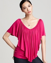 Command the center of attention in this brightly-colored Sweet Pea top that spotlights a dramatic, sweep-front ruffle. Command the center of attention in this brightly-colored Sweet Pea top that spotlights a dramatic, sweep-front ruffle.