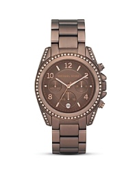 A rich espresso hue lends sophisticated shine to this stainless steel watch dial with rose-gold tone indexes and three-eye functionality. From Michael Kors. A rich espresso hue lends sophisticated shine to this stainless steel watch dial with rose-gold tone indexes and three-eye functionality. From Michael Kors.