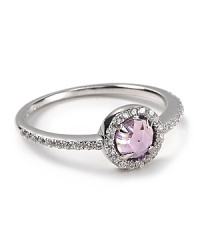 A checkerboard, dome cut center stone with talon prongs is surrounded in sparkling CZ stones on this small-but-statement-making Crislu ring. A checkerboard, dome cut center stone with talon prongs is surrounded in sparkling CZ stones on this small-but-statement-making Crislu ring.